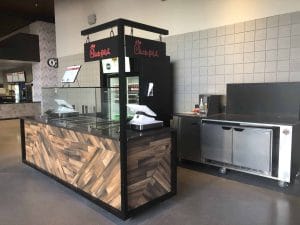 Wood paneled custom designed Food and Beverage Kiosk at Farm Arena in Atlanta