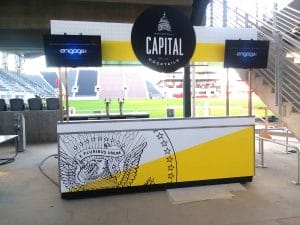 Local business food cart at Audi Field in Washington DC - custom designed yellow and white Capital food cart