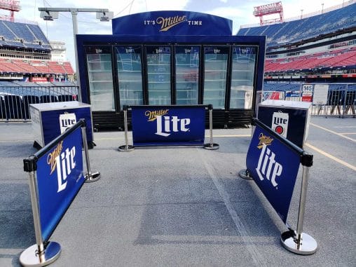 Miller Lite Grab-n-Go kiosk with three double coolers in a stadium.