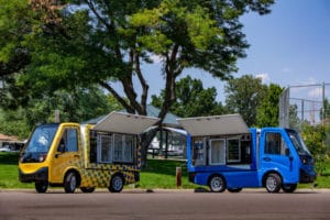 image of two food service electric vehicles | mobile carts kiosks food beverage retail sports entertainment venues travel centers hospitals 